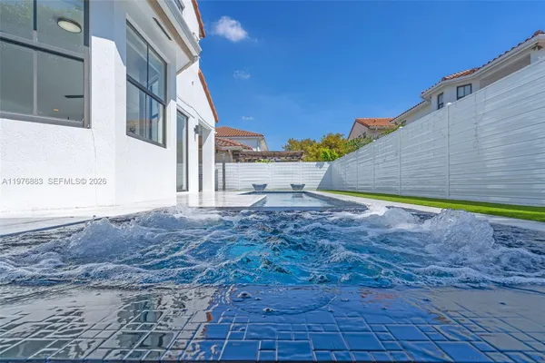 a bedroom with a bed and a book shelf