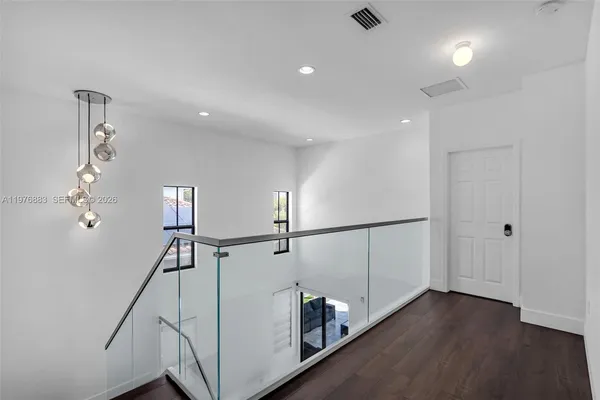 a view of room with air conditioner and empty room