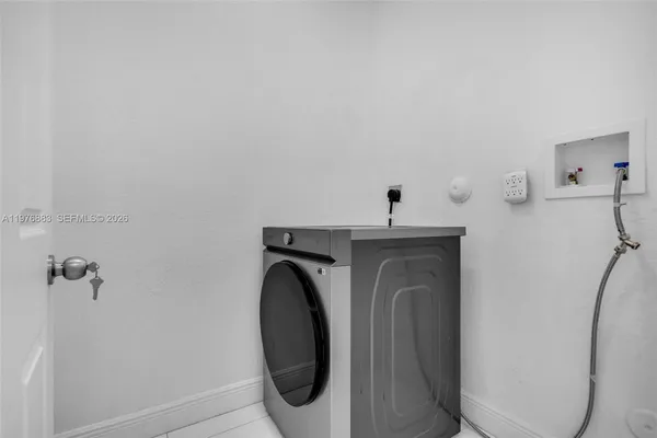a en suite bathroom with a granite countertop sink a toilet and shower