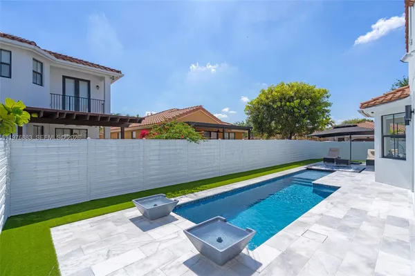 a view of a backyard with a patio