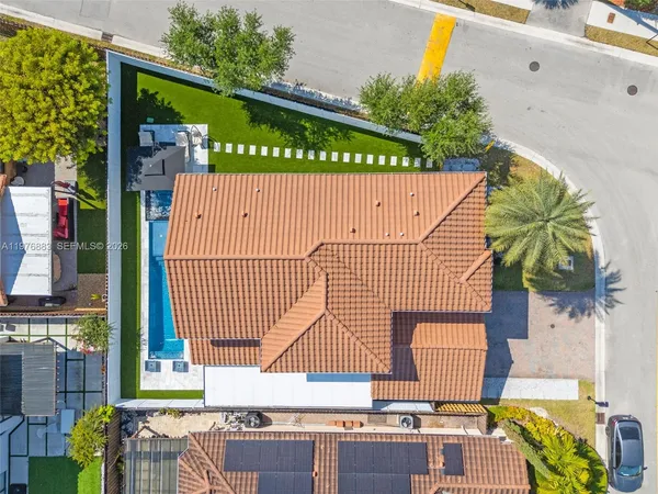 an aerial view of residential building and lake