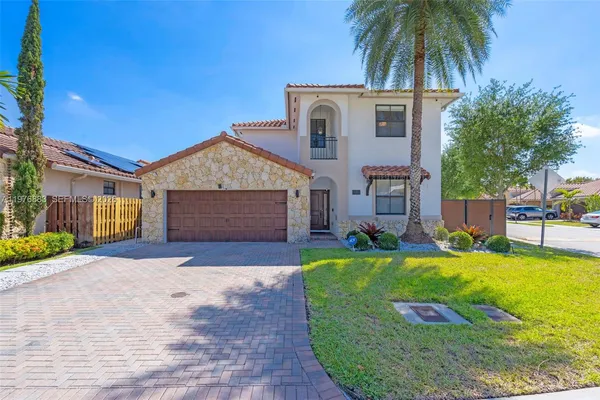 an aerial view of residential building and lake