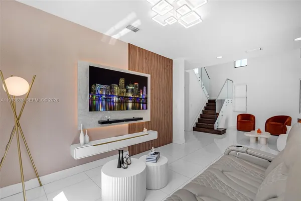 a kitchen with stainless steel appliances a stove sink and refrigerator