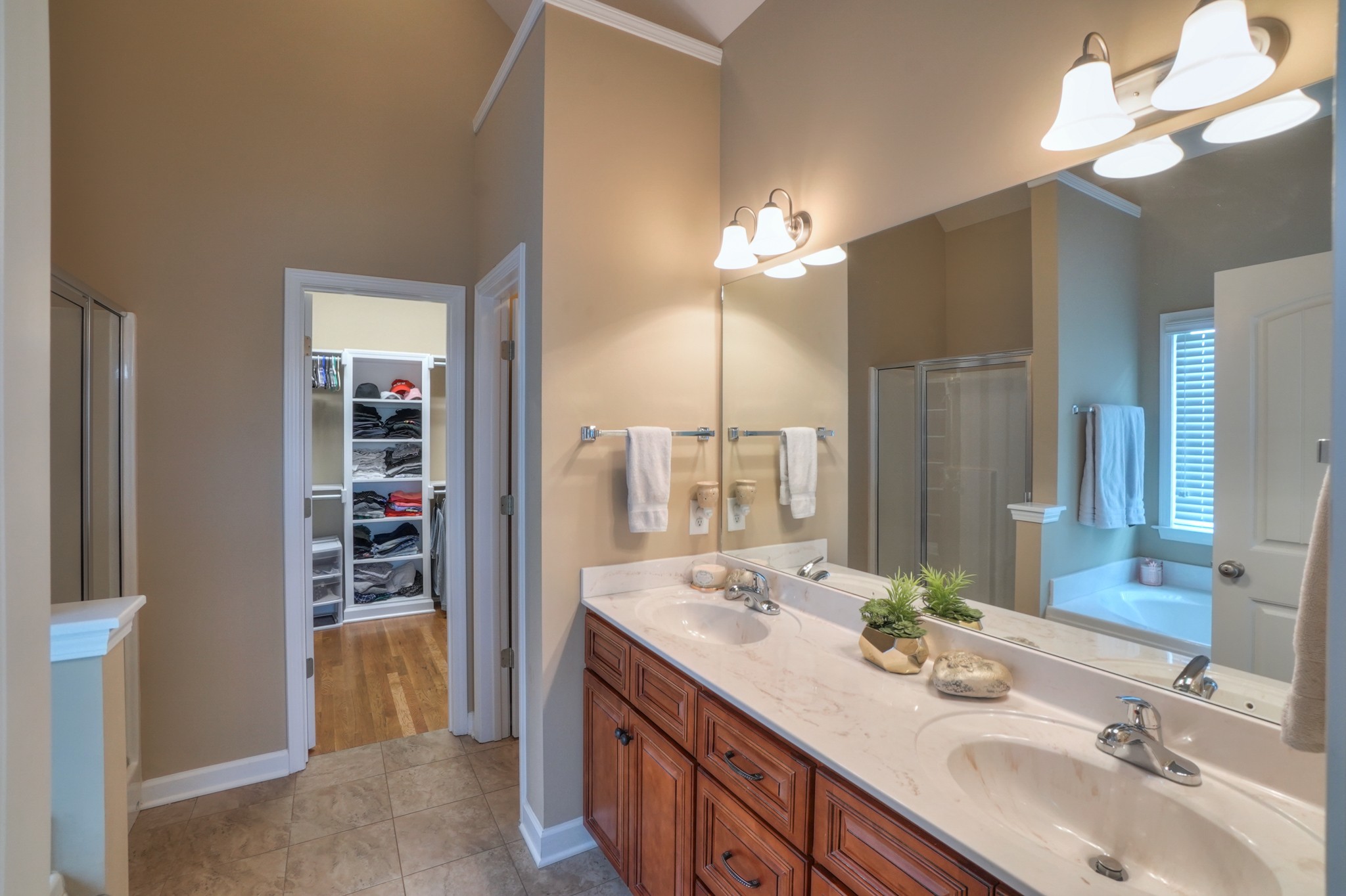 8011 Ragusa Circle Spring Hill, TN 37174 - Photo 14 of 27 a bathroom with a double vanity sink and a mirror