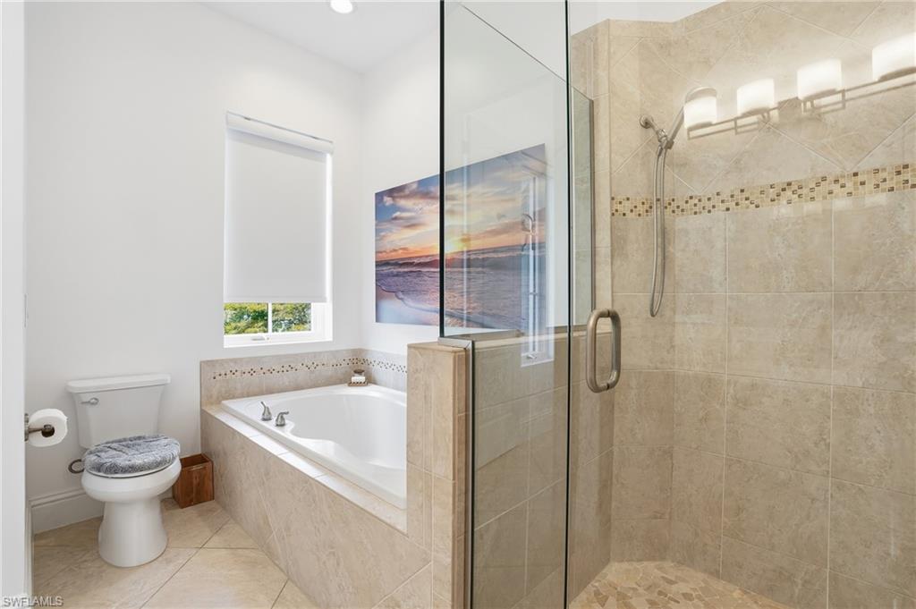 1008 7th Street South, Unit B1 Naples, FL 34102 - Photo 26 of 48 Bathroom with a shower stall, tile patterned floors, a bath, and recessed lighting