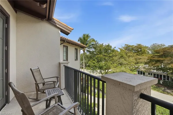 a view of balcony with furniture