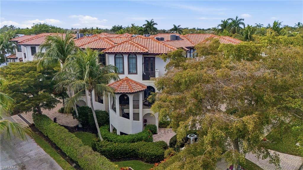 1008 7th Street South, Unit B1 Naples, FL 34102 - Photo 3 of 48 View of front of home with stucco siding, a tiled roof, and a gazebo
