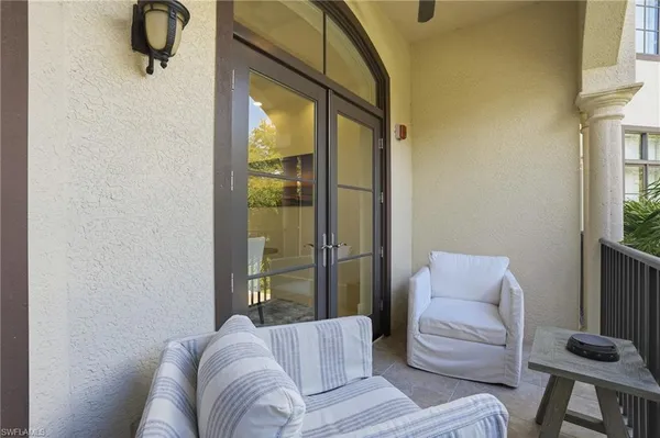 a view of balcony with furniture and flowers