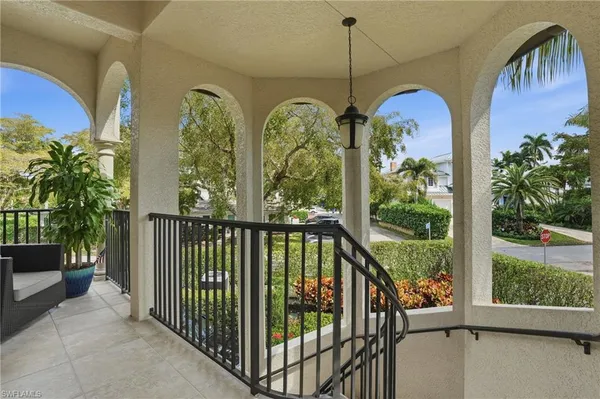 a view of balcony with furniture