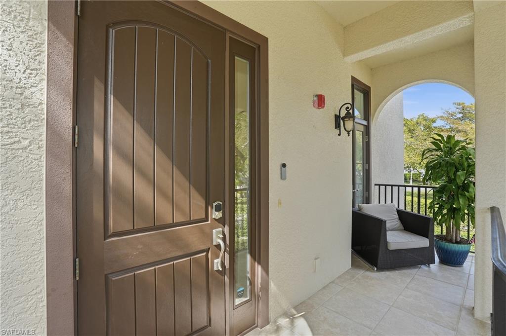 1008 7th Street South, Unit B1 Naples, FL 34102 - Photo 10 of 48 Property entrance featuring stucco siding