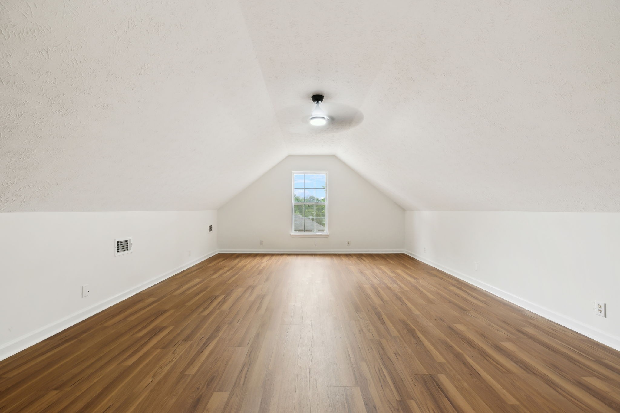 1075 Kathryn Road Mount Juliet, TN 37122 - Photo 23 of 27 an empty room with wooden floor and windows