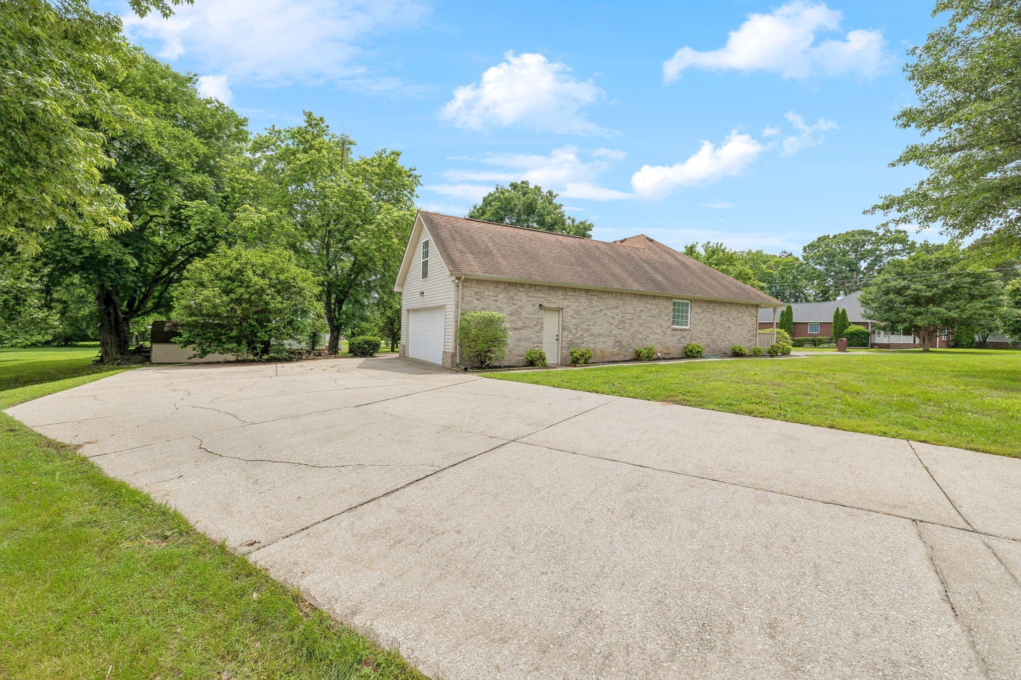 1075 Kathryn Road Mount Juliet, TN 37122 - Photo 27 of 27 a view of a house with a yard and large tree