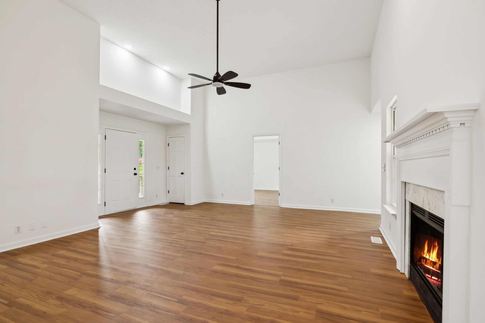 1075 Kathryn Road Mount Juliet, TN 37122 - Photo 5 of 27 a view of empty room with wooden floor and fireplace