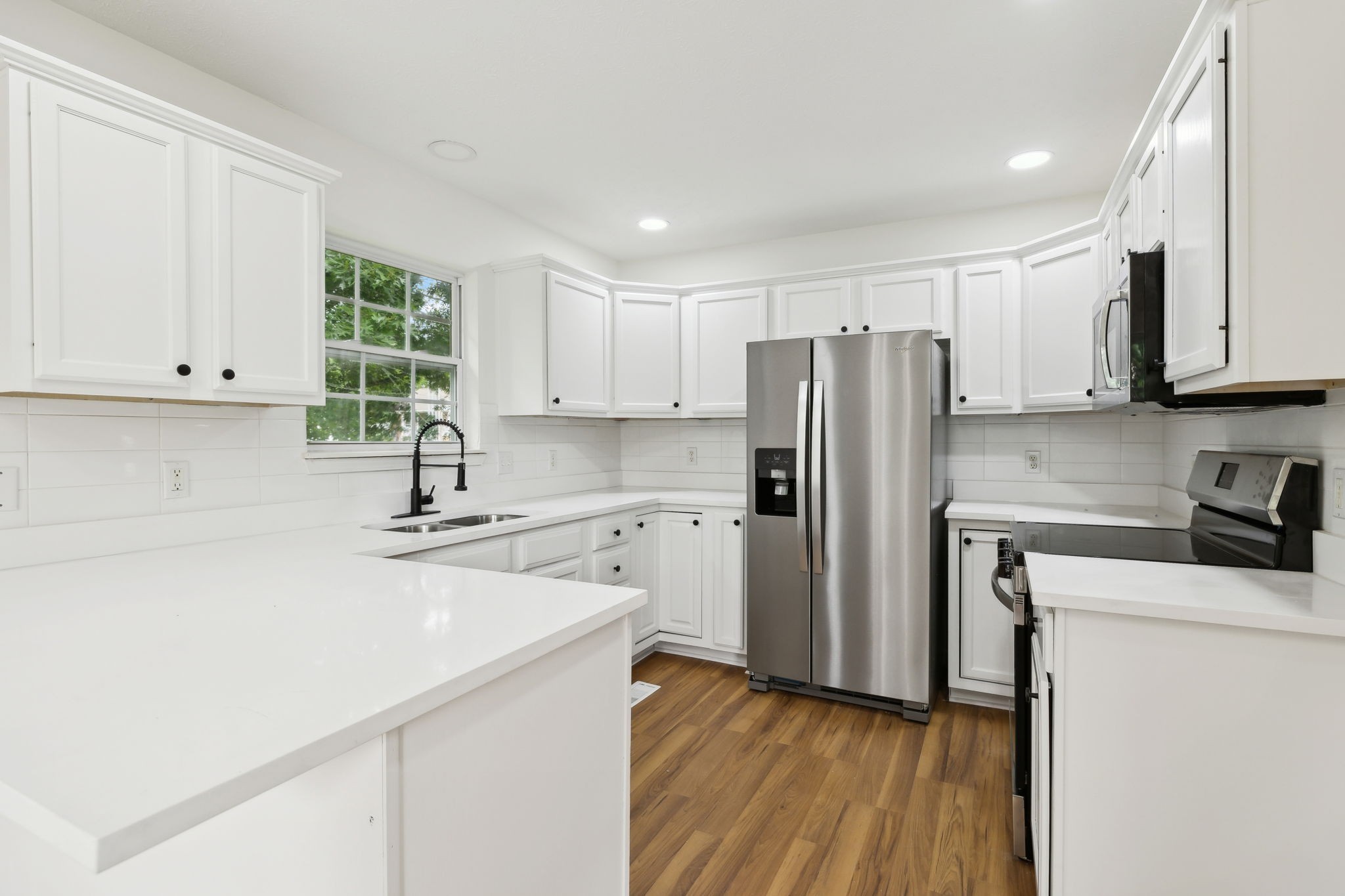 1075 Kathryn Road Mount Juliet, TN 37122 - Photo 8 of 27 a kitchen with stainless steel appliances a refrigerator sink and cabinets