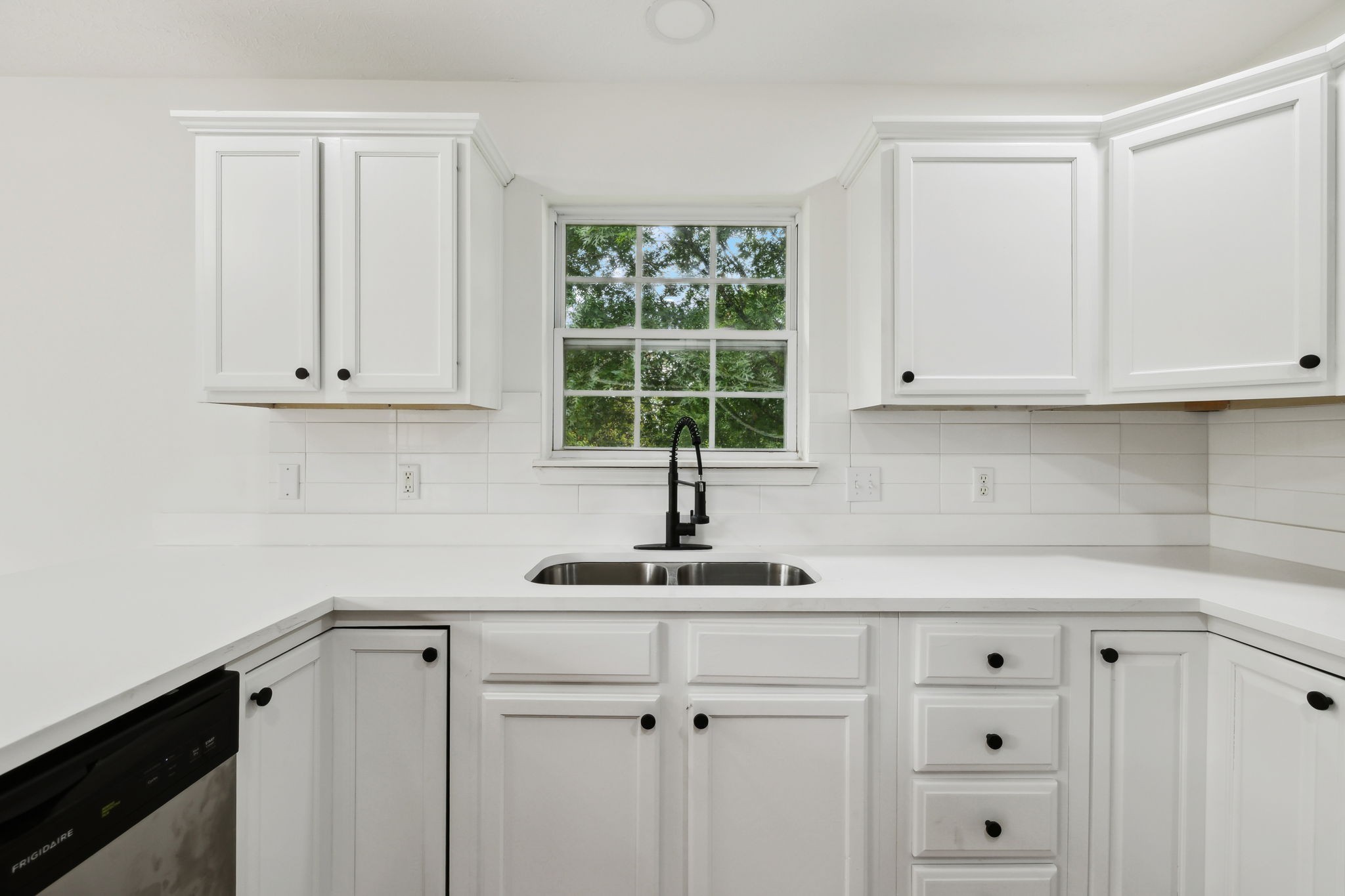 1075 Kathryn Road Mount Juliet, TN 37122 - Photo 9 of 27 a kitchen with stainless steel appliances white cabinets and a window
