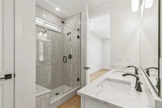 a bathroom with a sink shower and a bathtub