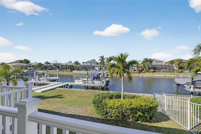 a view of a swimming pool with a lake view and a ocean view