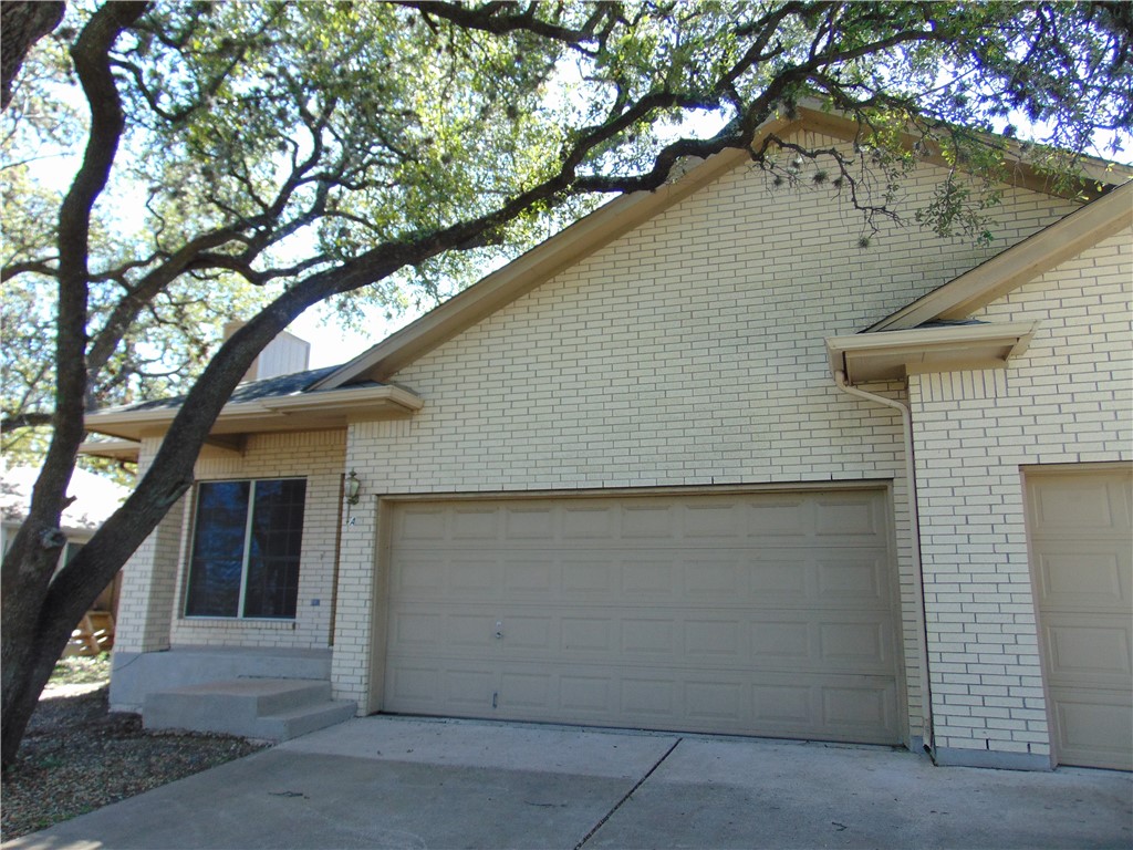 7303 Oak Meadow Drive, Unit A Austin, TX 78736 - Photo 1 of 1 front view of a house with a tree