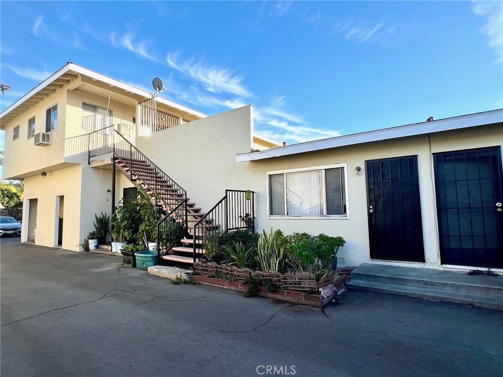 12922 Shackelford Lane Garden Grove, CA 92841 - Photo 1 of 12 a front view of a house with a yard