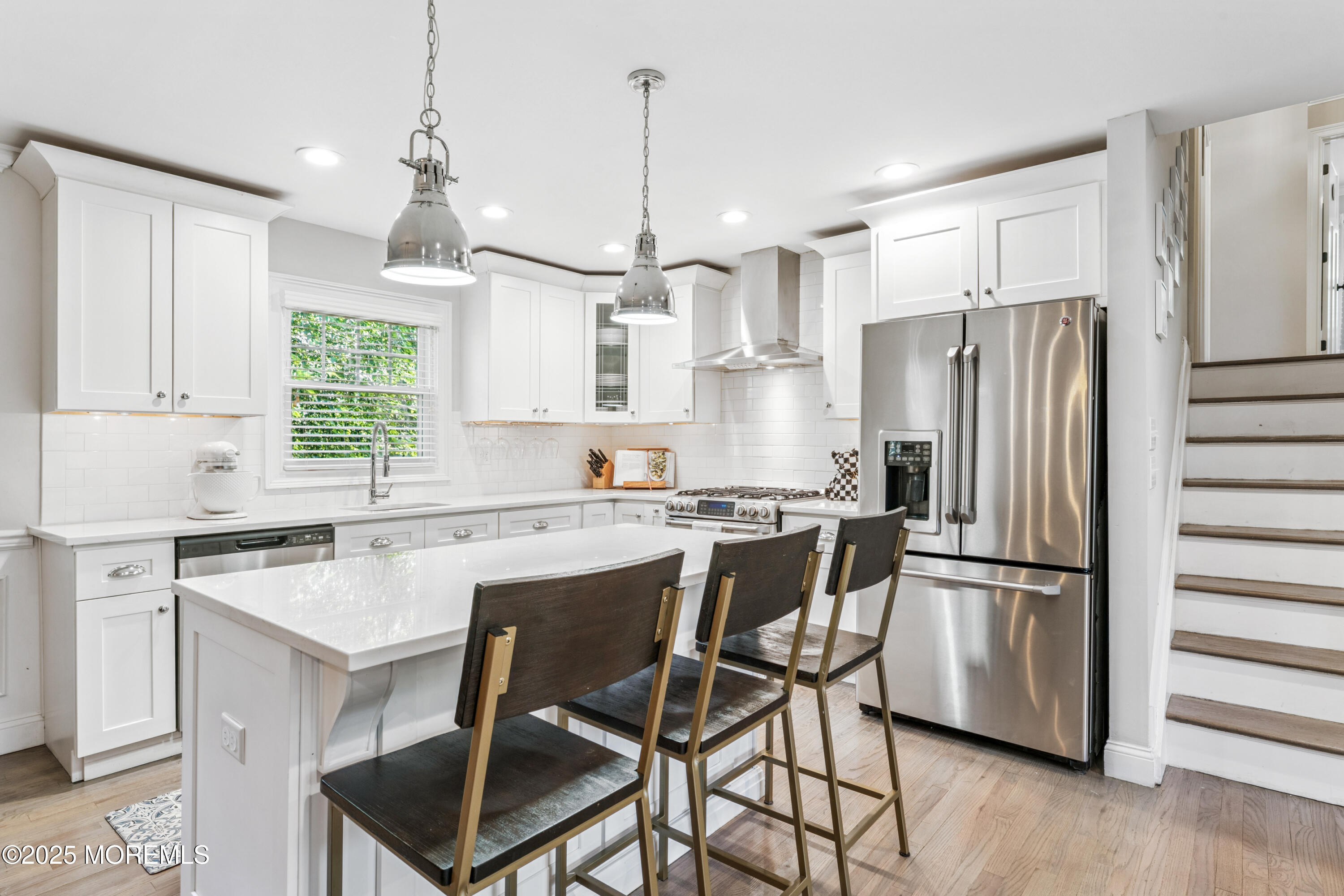 28 High Point Road Lincroft, NJ 07738 - Photo 13 of 42 a kitchen with stainless steel appliances granite countertop a refrigerator a sink dishwasher a stove and white cabinets with wooden floor