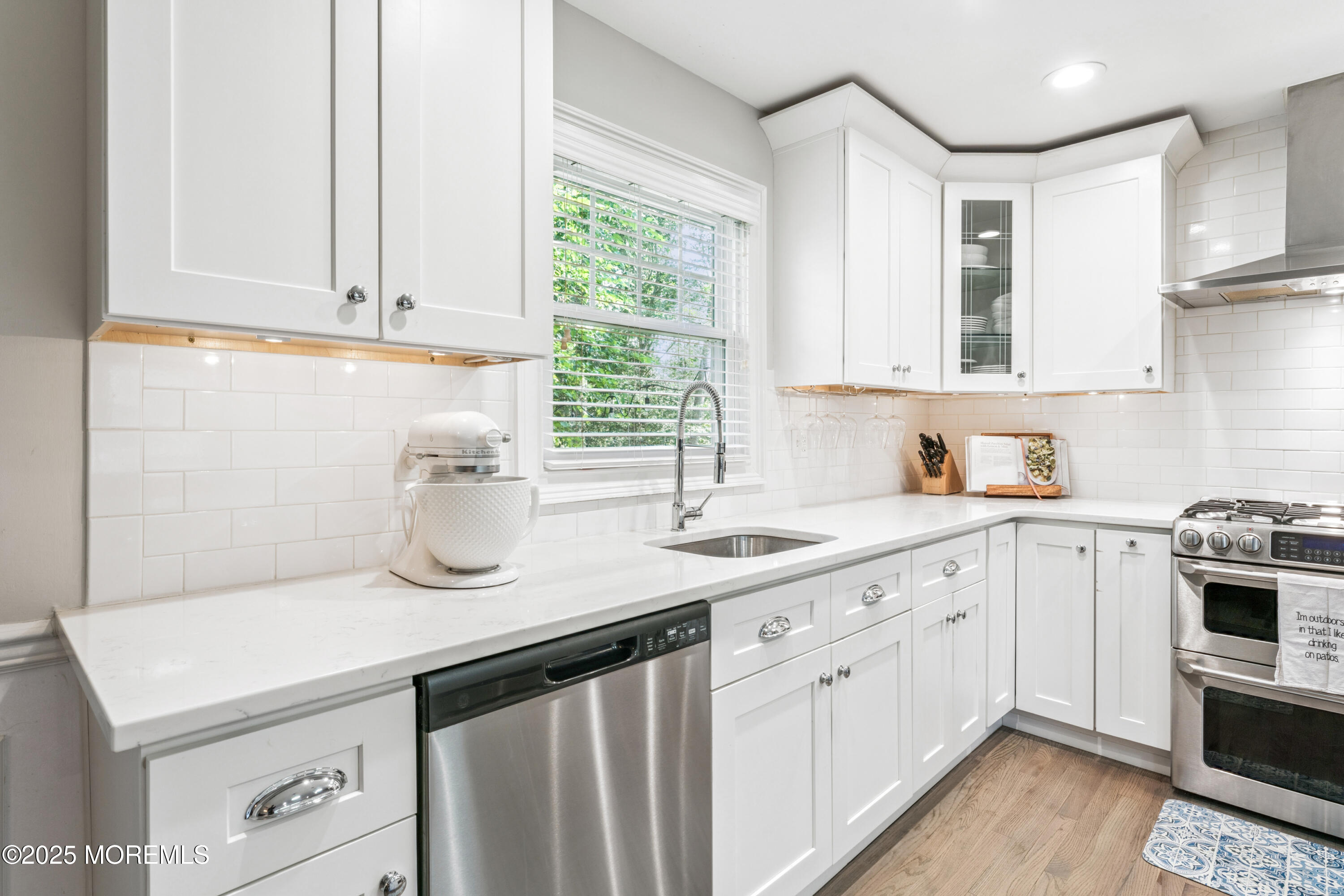 28 High Point Road Lincroft, NJ 07738 - Photo 16 of 42 a kitchen with granite countertop white cabinets and white appliances