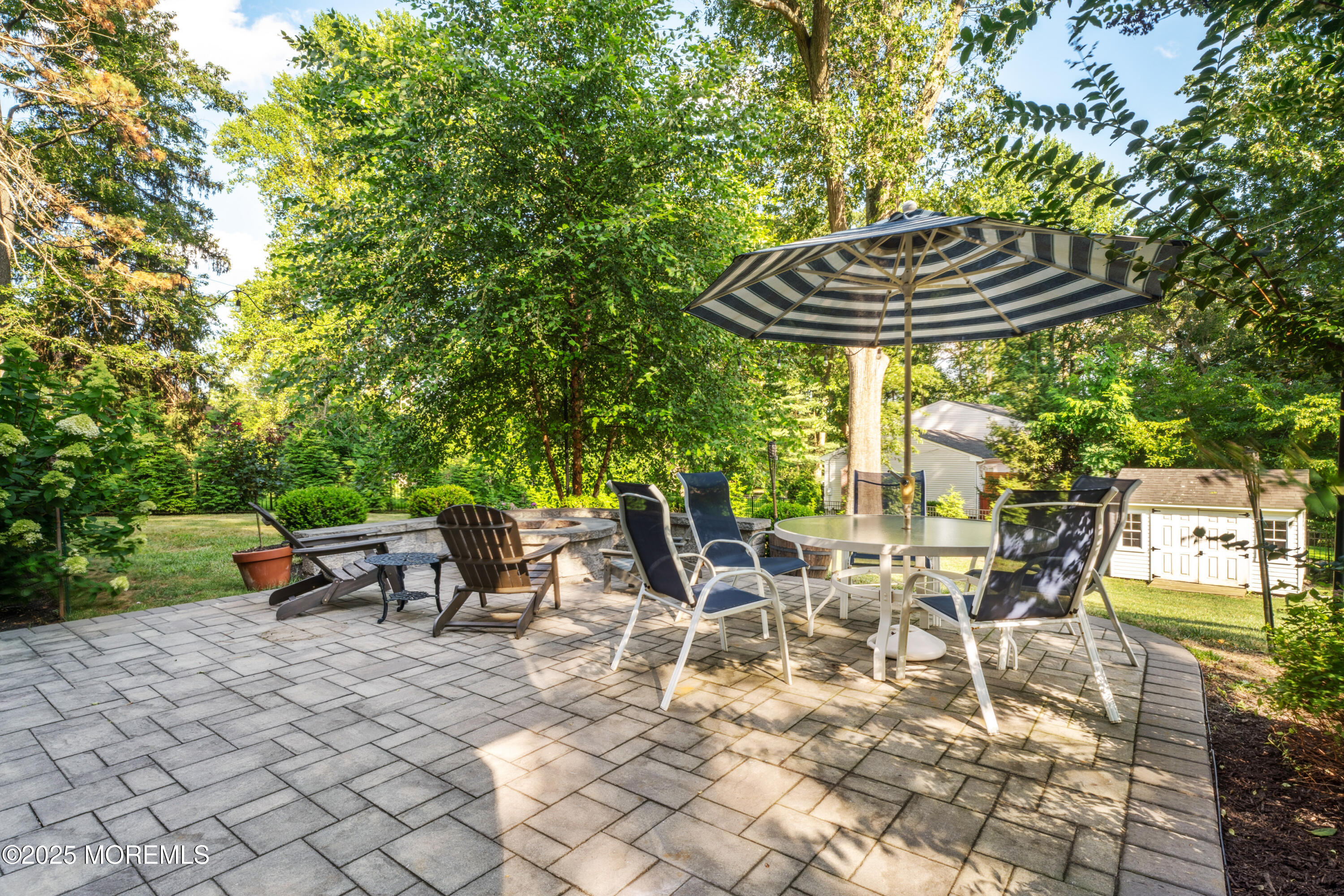 28 High Point Road Lincroft, NJ 07738 - Photo 32 of 42 a backyard of a house with table and chairs