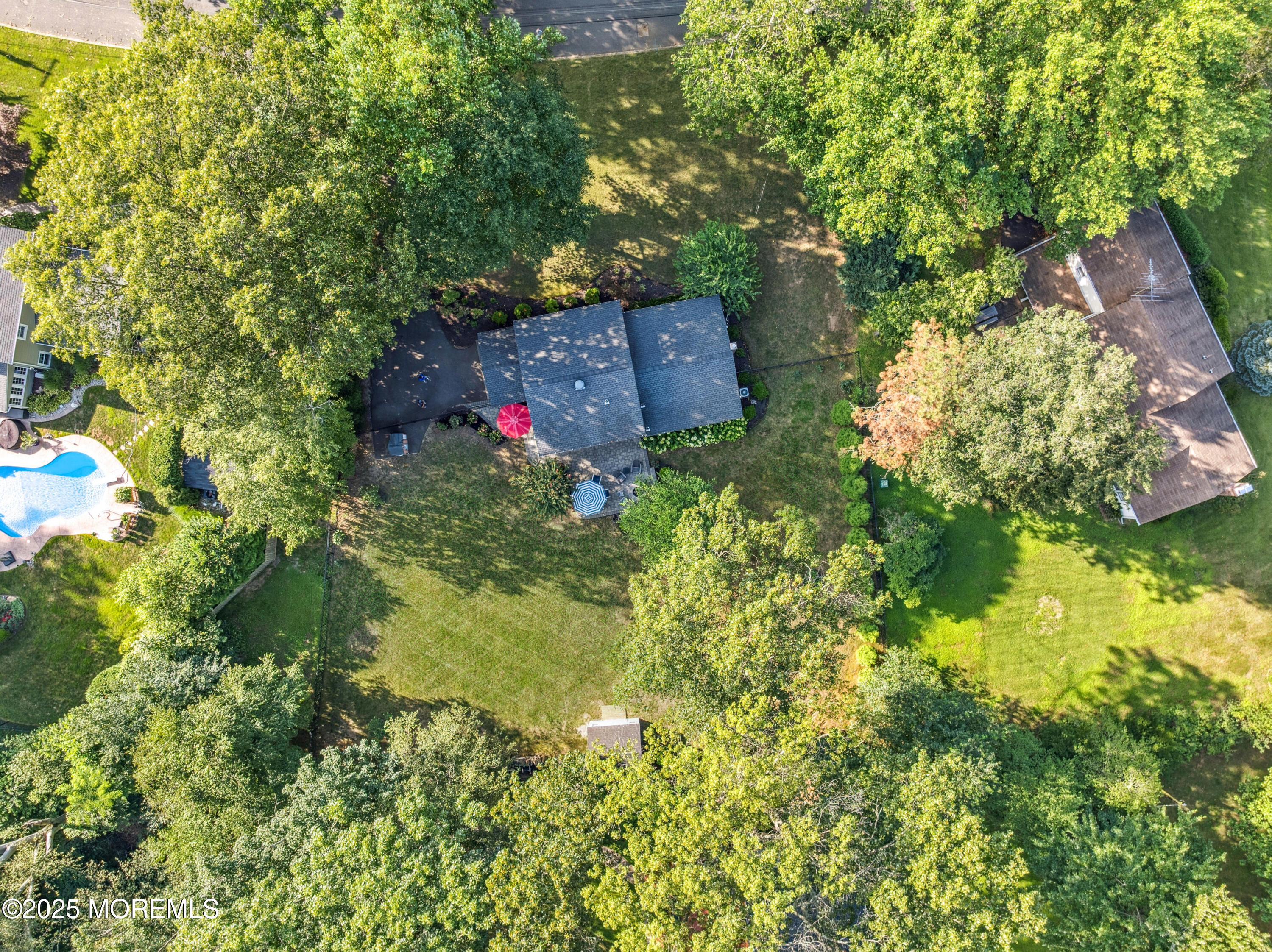 28 High Point Road Lincroft, NJ 07738 - Photo 35 of 42 a backyard of a house with yard and outdoor seating