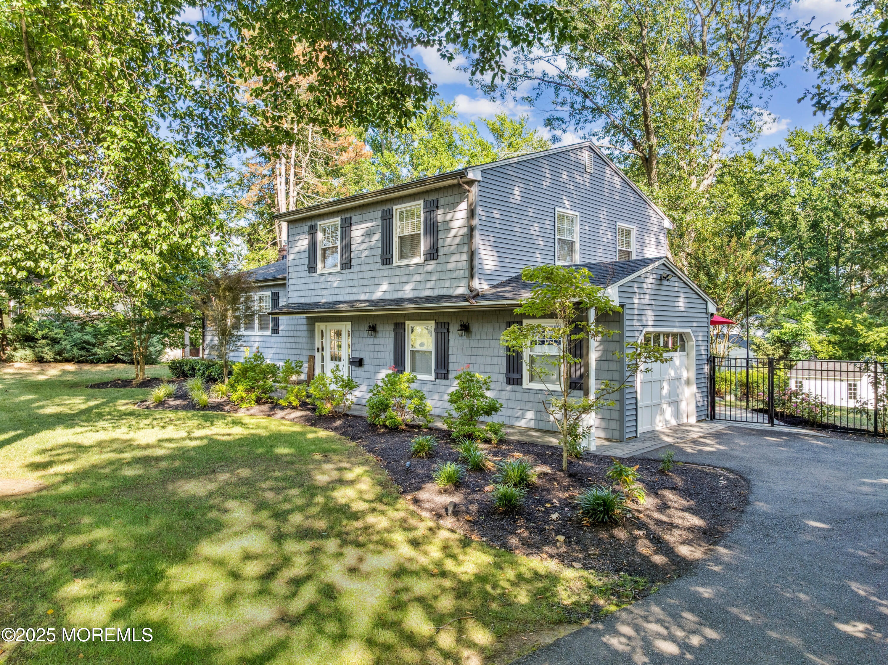 28 High Point Road Lincroft, NJ 07738 - Photo 37 of 42 a front view of house with a garden