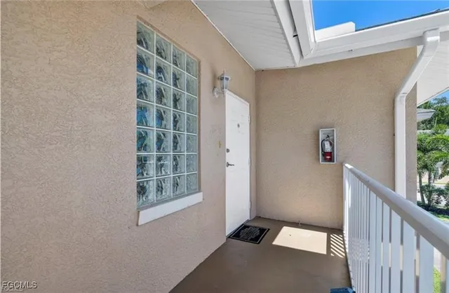 a view of an empty room with windows