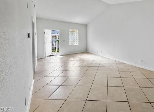 a view of an empty room and window