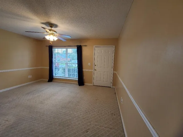 wooden floor in an empty room and a bathroom