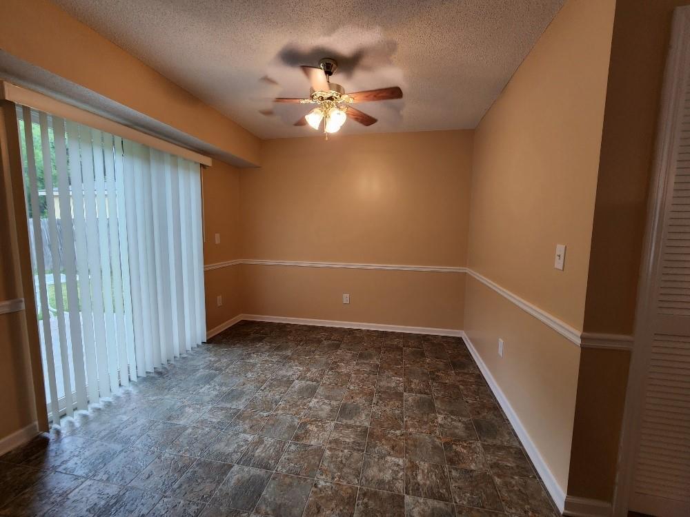 663 Elliott Drive Northwest Rome, GA 30165 - Photo 3 of 9 wooden floor in an empty room and a bathroom