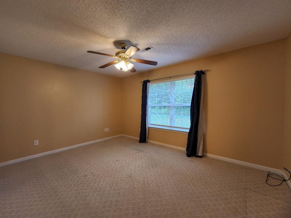 663 Elliott Drive Northwest Rome, GA 30165 - Photo 4 of 9 an empty room with a view of a livingroom
