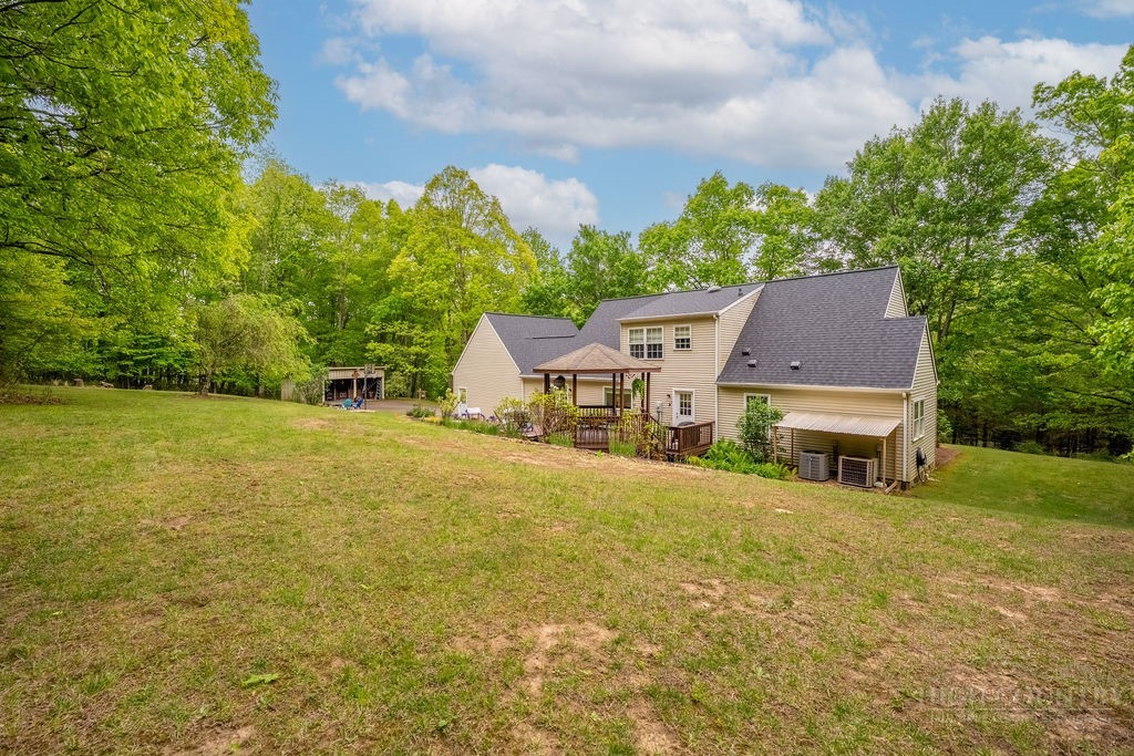 970 Vox Road Sparta, NC 28675 - Photo 14 of 50 an aerial view of a house with yard and swimming pool