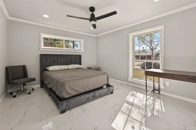 a bedroom with a bed and a table