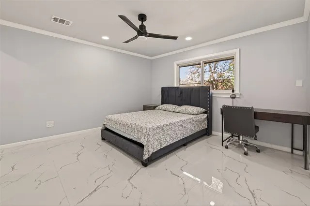 a bathroom with a granite countertop sink a toilet and a mirror
