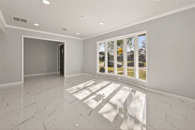 a view of a hallway with windows