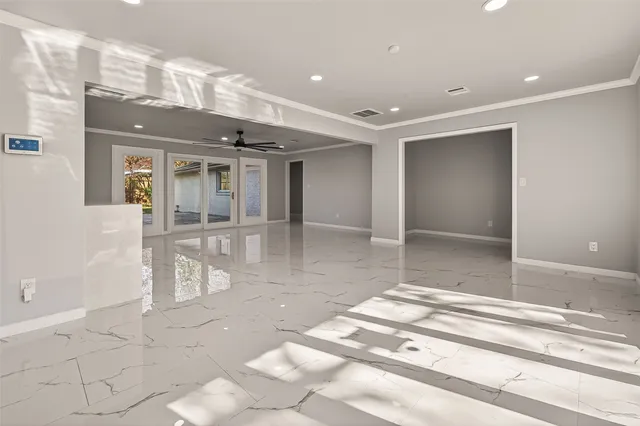 a view of an empty room with a window