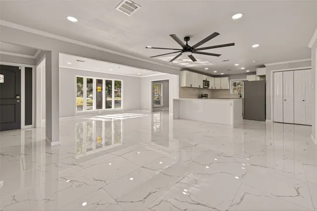 a view of a kitchen with an empty space and window