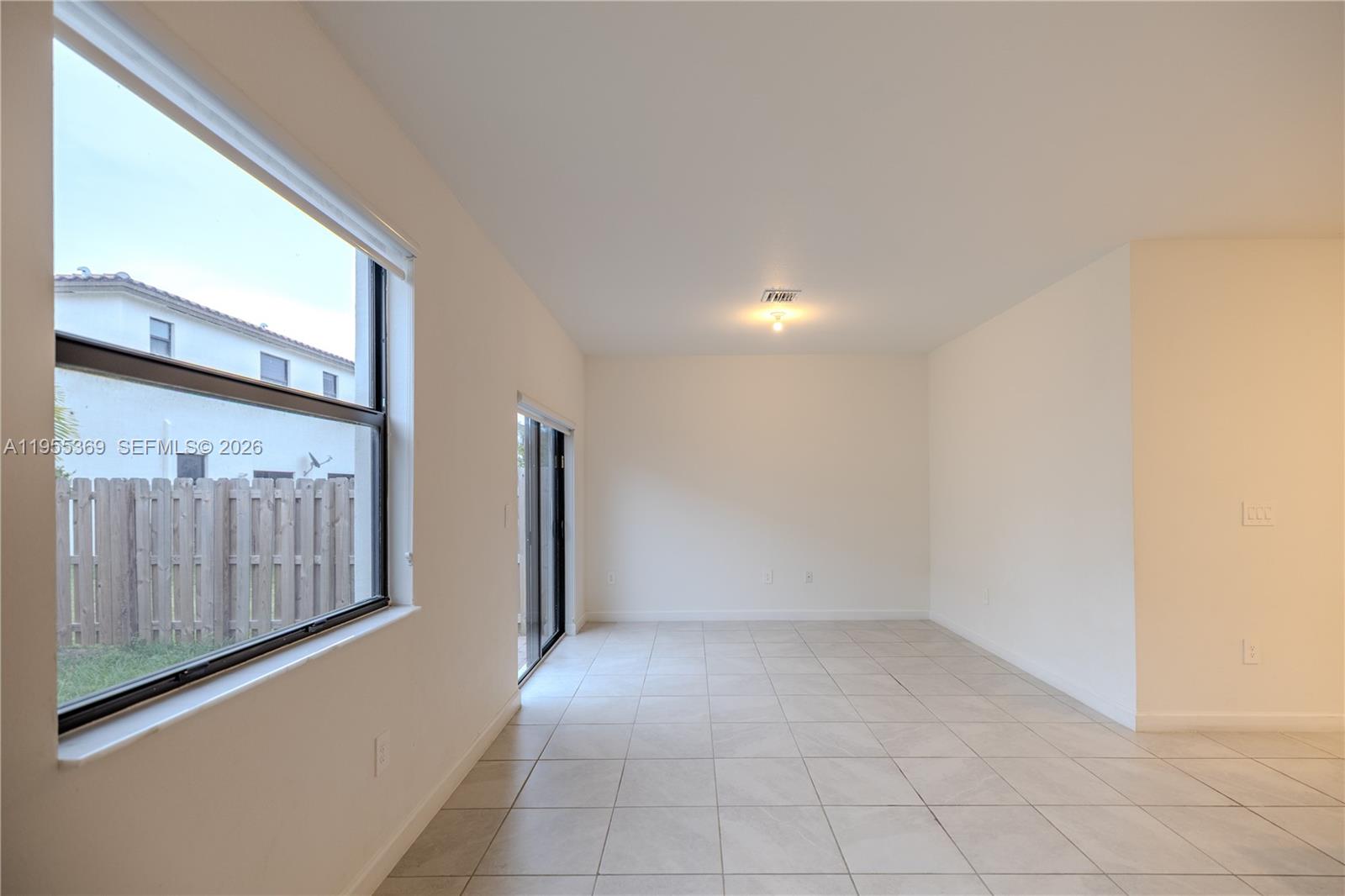 24671 Southwest 119th Place Homestead, FL 33032 - Photo 12 of 31 a view of an empty room with a window