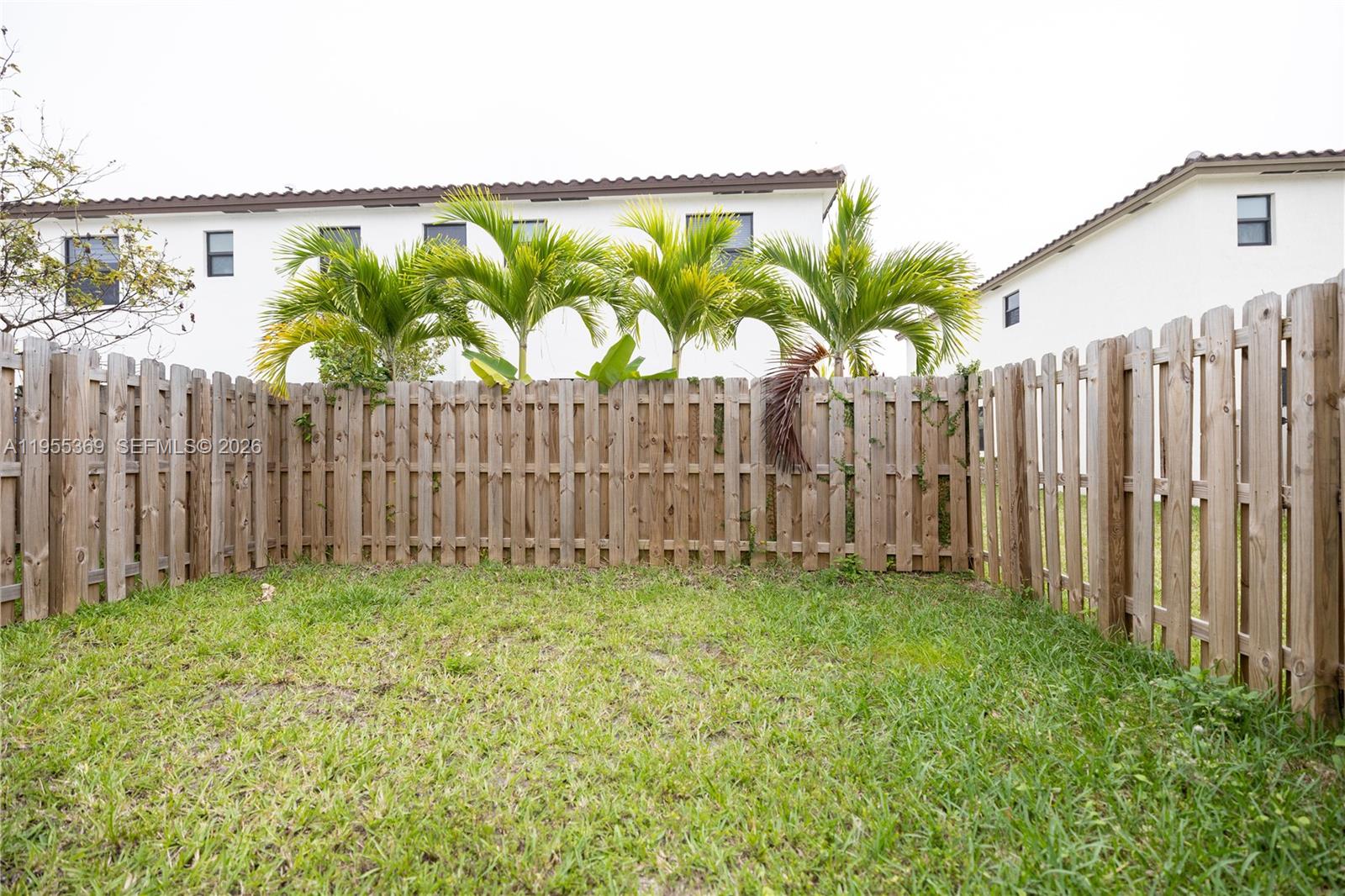 24671 Southwest 119th Place Homestead, FL 33032 - Photo 13 of 31 a view of a garden with a building in the back