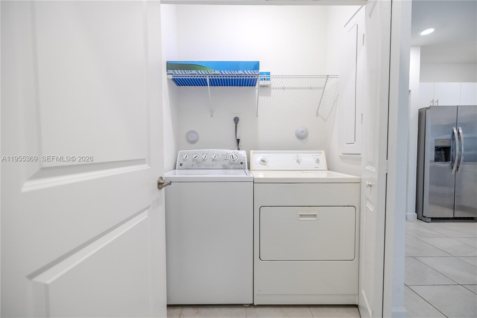 24671 Southwest 119th Place Homestead, FL 33032 - Photo 14 of 31 a utility room with dryer and washer