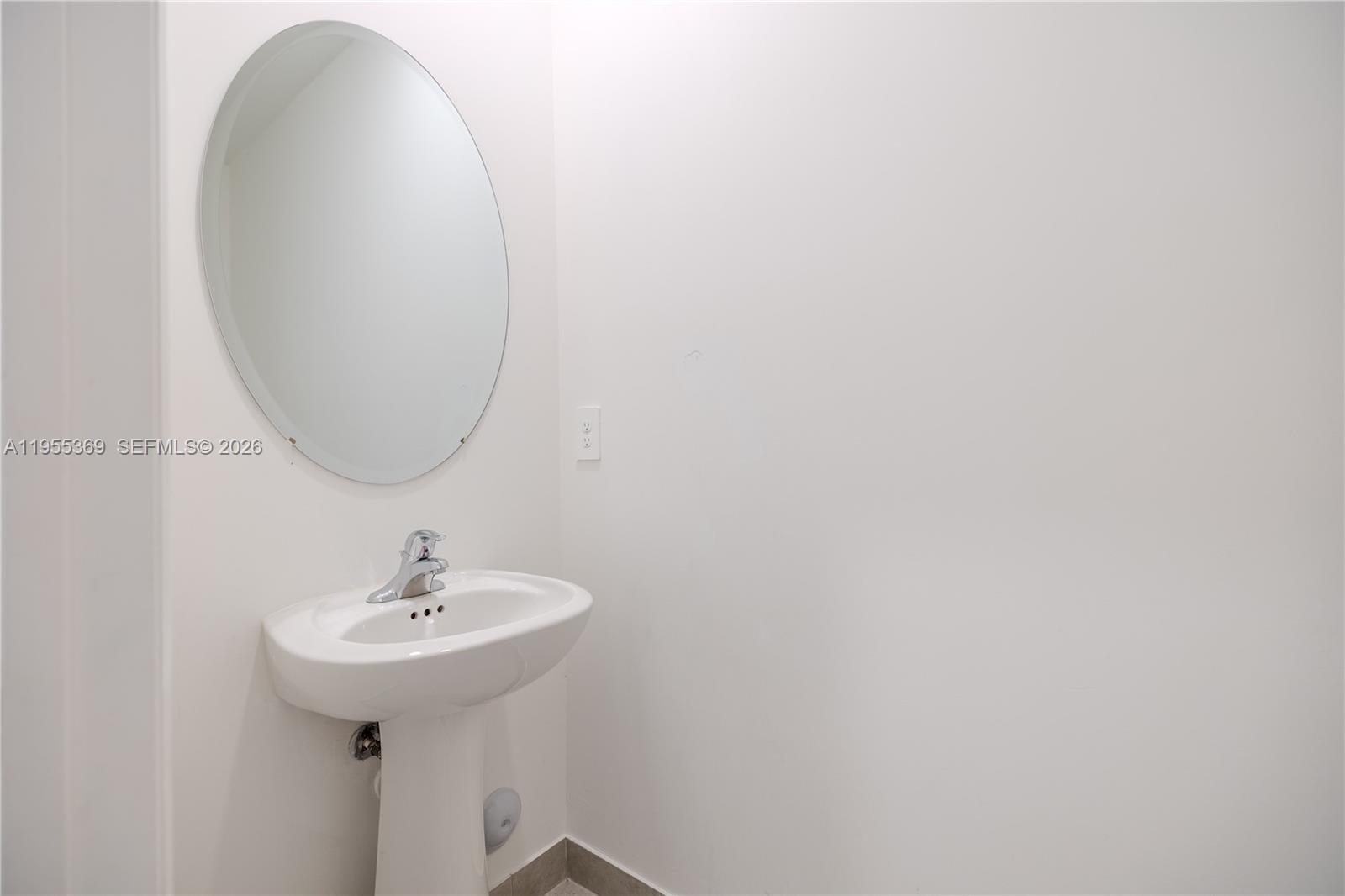 24671 Southwest 119th Place Homestead, FL 33032 - Photo 15 of 31 a bathroom with a sink and mirror