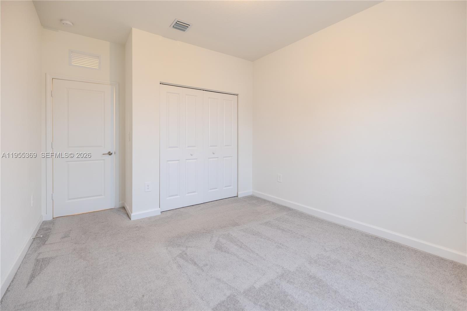 24671 Southwest 119th Place Homestead, FL 33032 - Photo 18 of 31 an empty room with closet area