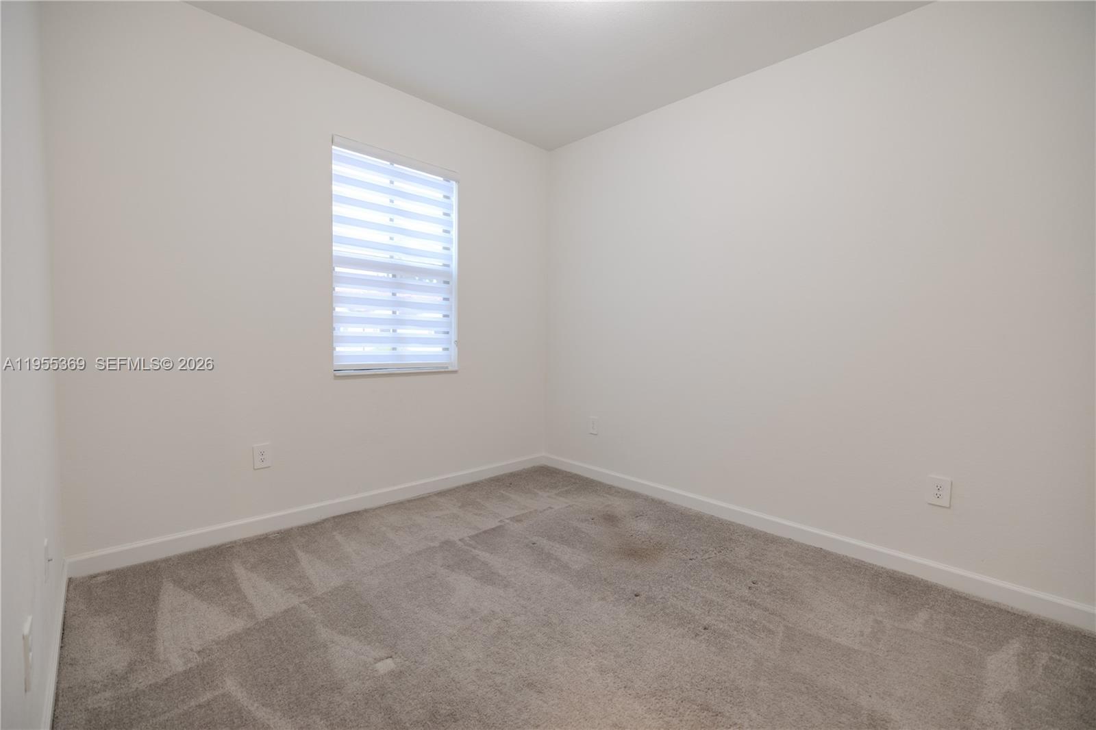 24671 Southwest 119th Place Homestead, FL 33032 - Photo 21 of 31 an empty room with a window
