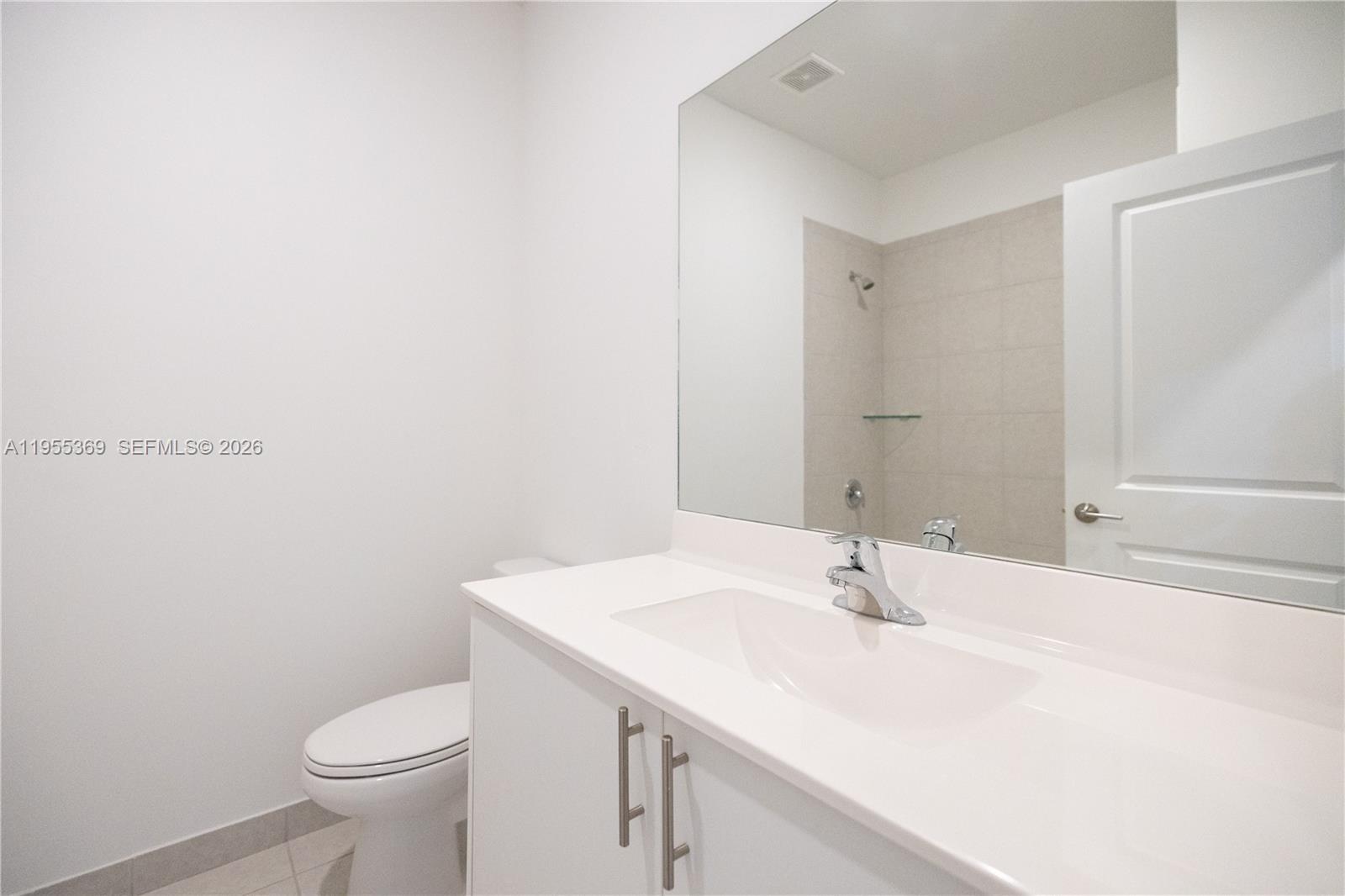 24671 Southwest 119th Place Homestead, FL 33032 - Photo 24 of 31 a bathroom with a sink and a toilet