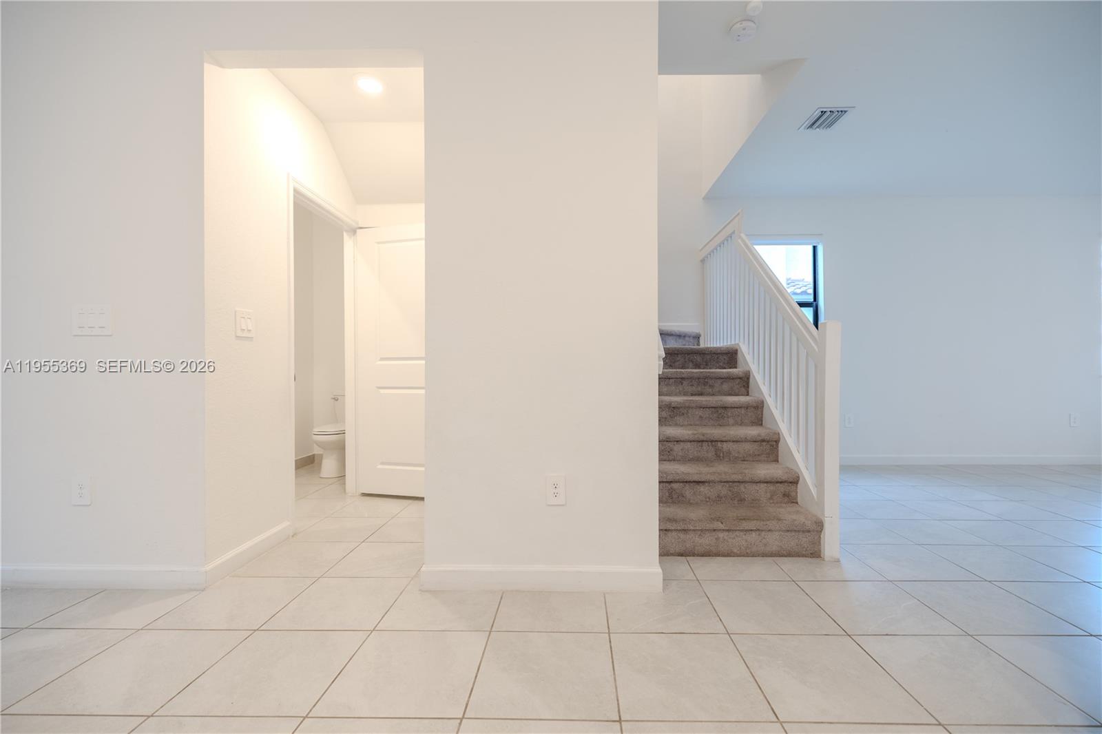 24671 Southwest 119th Place Homestead, FL 33032 - Photo 8 of 31 a view of an entryway with staircase
