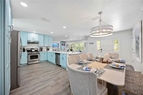 a kitchen with a sink stainless steel appliances and cabinets