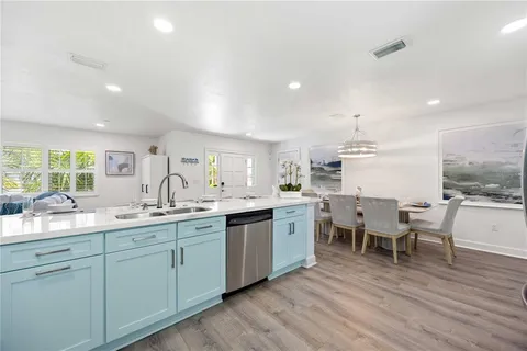 a kitchen with lots of counter top space and sink