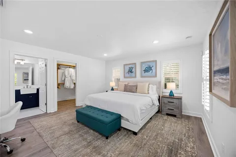 a bedroom with a large bed and a couch